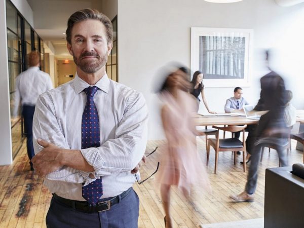 portrait-of-middle-aged-white-man-in-a-busy-PEZGY3X-1024x683